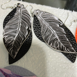 Multilayered faux leather feather look earrings